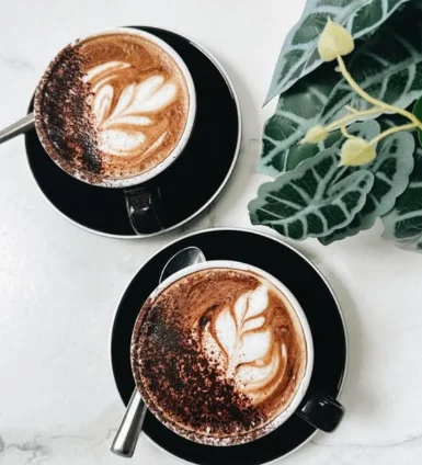 Two coffees with latte art at PointBreak Cafe, Coolangatta